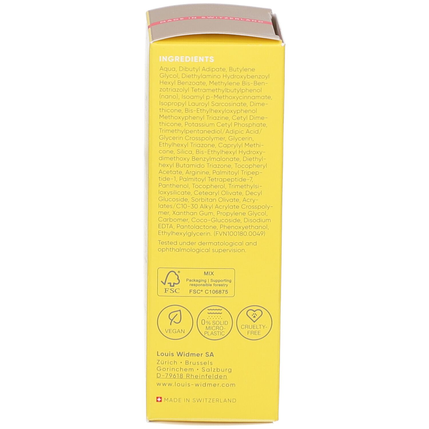 Dos de l'emballage jaune. Ingrédients, logos, origine Suisse, Vegan, 0% microplastique, Cruelty Free, FSC.