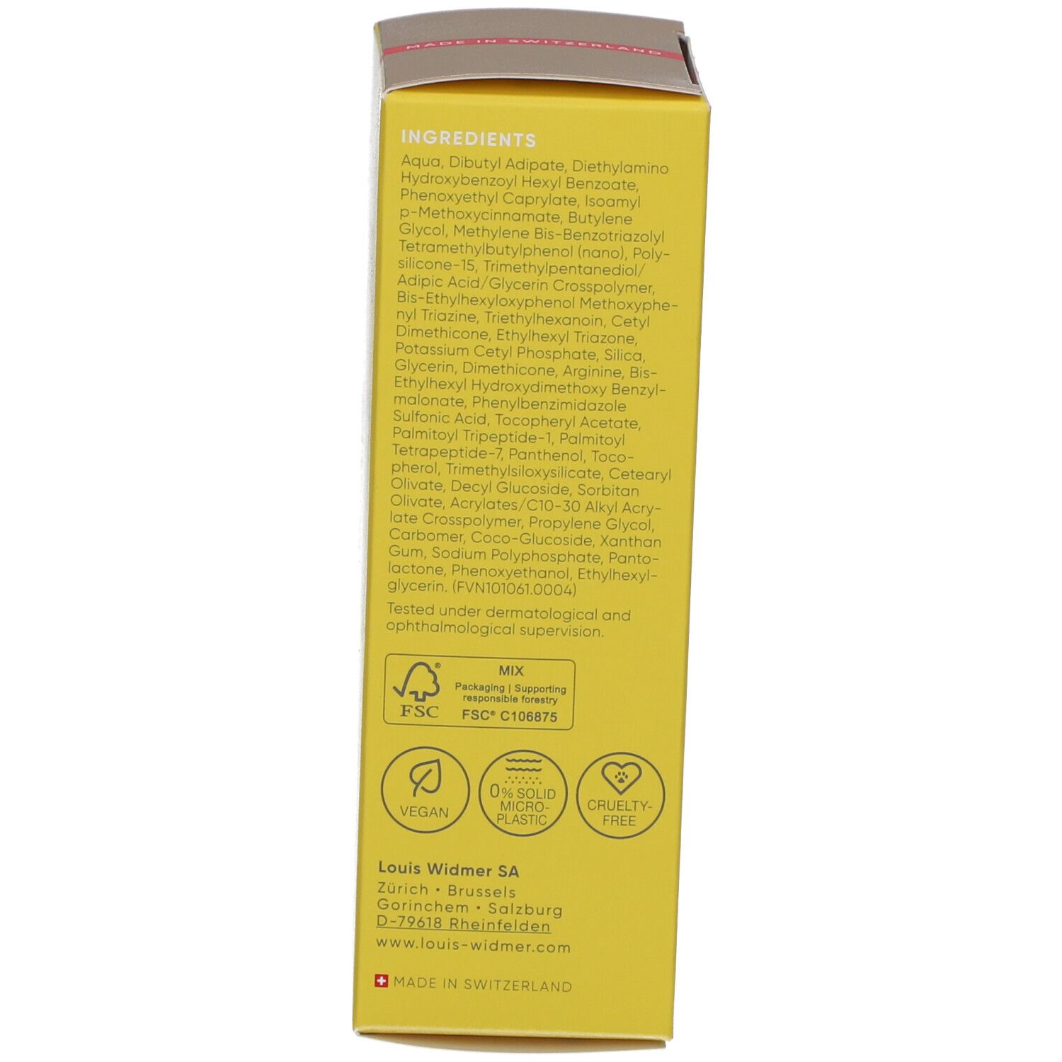 Dos de la boîte de crème solaire. Contient des ingrédients, des certifications et des informations sur le fabricant.