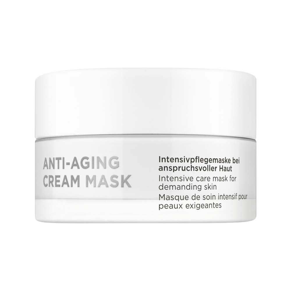 Masque crème blanc en pot blanc. Inscription : ANTI-AGING CREAM MASK. Texte en allemand, anglais et français.