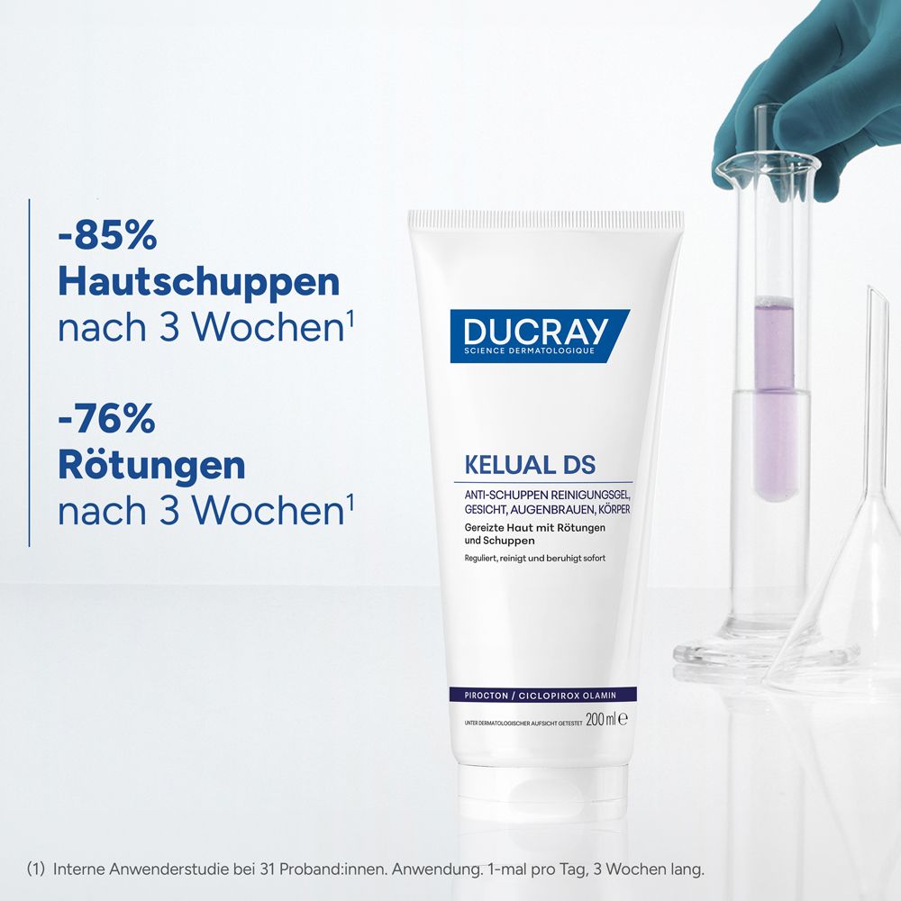 Tube Ducray Kelual DS Gel mit Laborgeräten. Text: -85% Hautschuppen nach 3 Wochen, -76% Rötungen nach 3 Wochen.