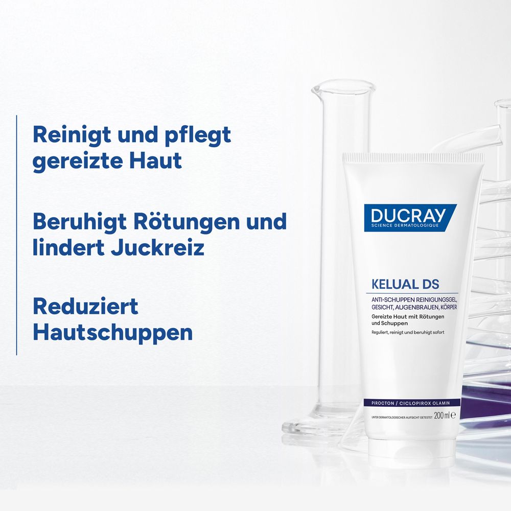 Tube Ducray Kelual DS Gel mit Laborgeräten. Text: Reinigt und pflegt gereizte Haut, Beruhigt Rötungen und lindert Juckreiz, Reduziert Hautschuppen.