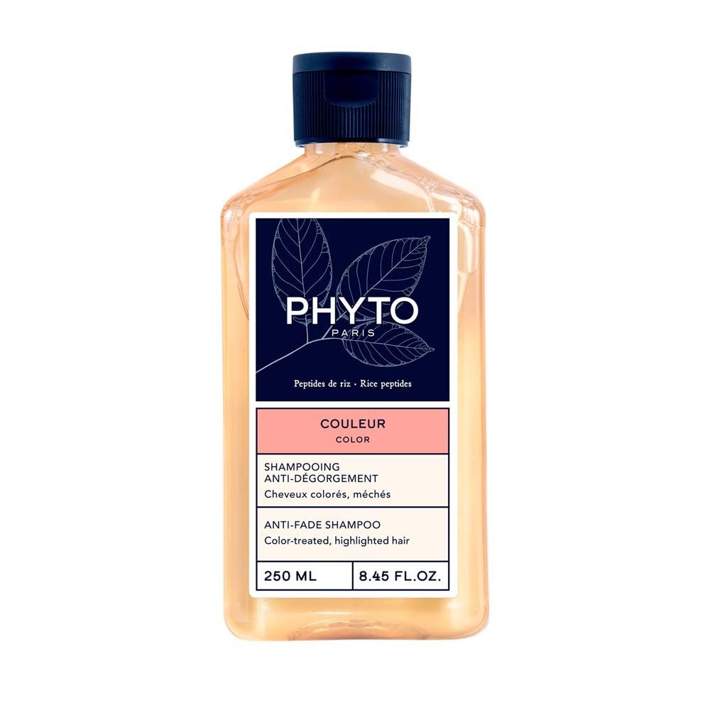 Flasche PHYTO PARIS Shampoo, farbe, mit blauer Kappe. Etikett mit Logo und Produktinformationen.