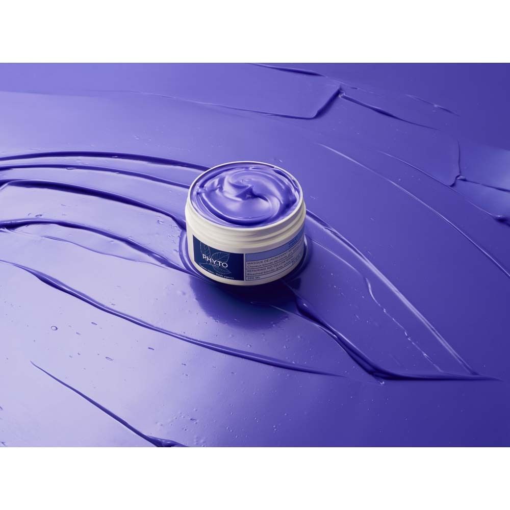 Pot ouvert avec masque violet sur fond violet. Inscription : PHYTO PARIS.