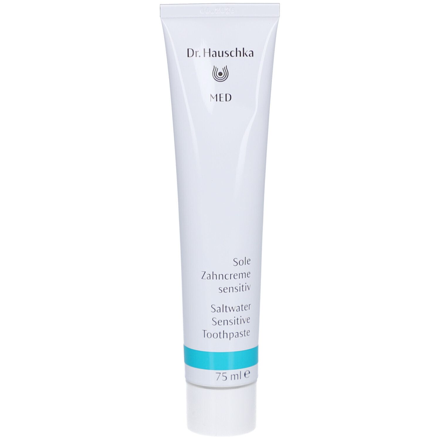 Tube blanche avec texte bleu. Contient du dentifrice. Inscription: Dr. Hauschka MED, Sole Zahncreme sensitiv, 75 ml.