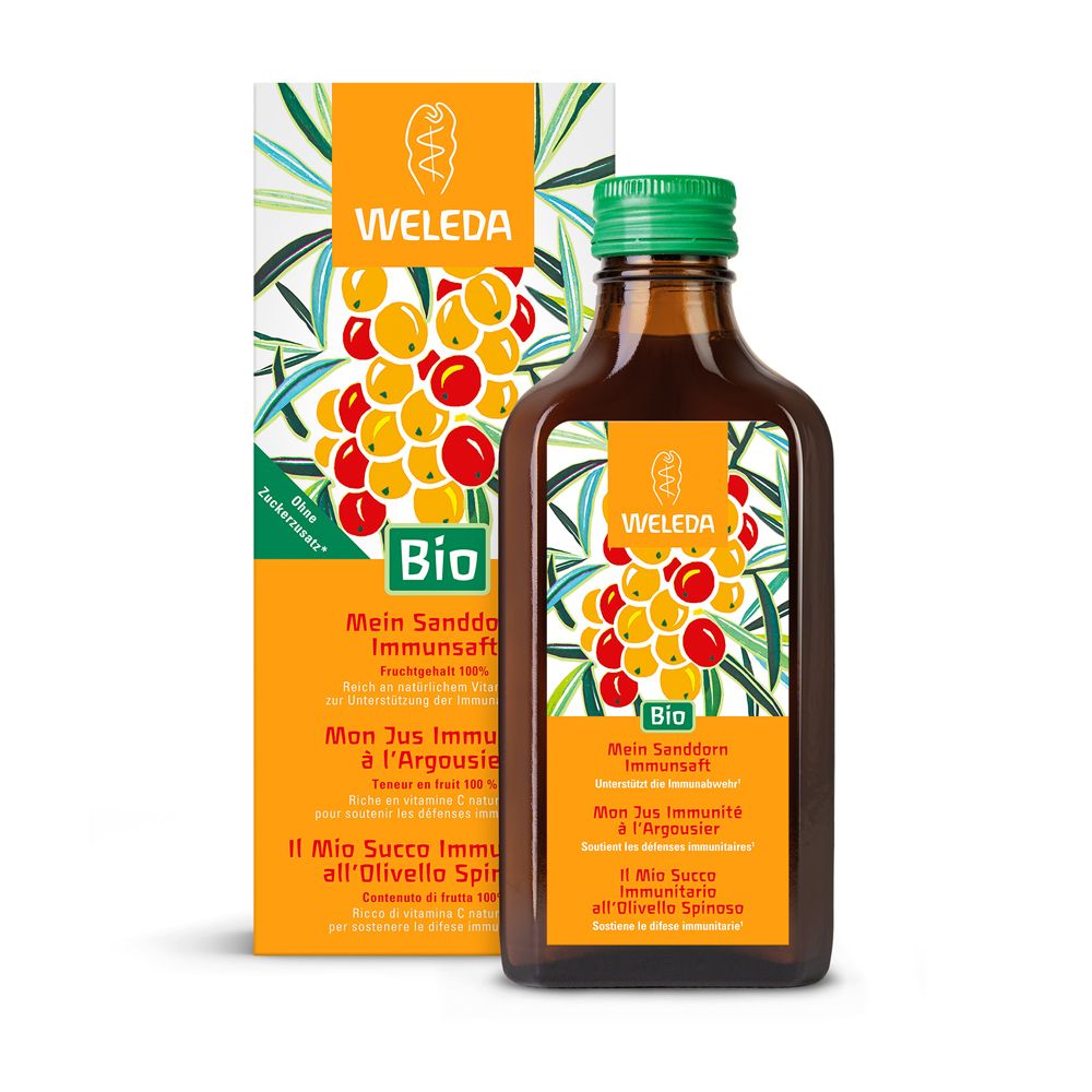 Braune Glasflasche mit grünem Deckel und Etikett. Daneben eine orangefarbene Verpackung mit Produktinformationen.