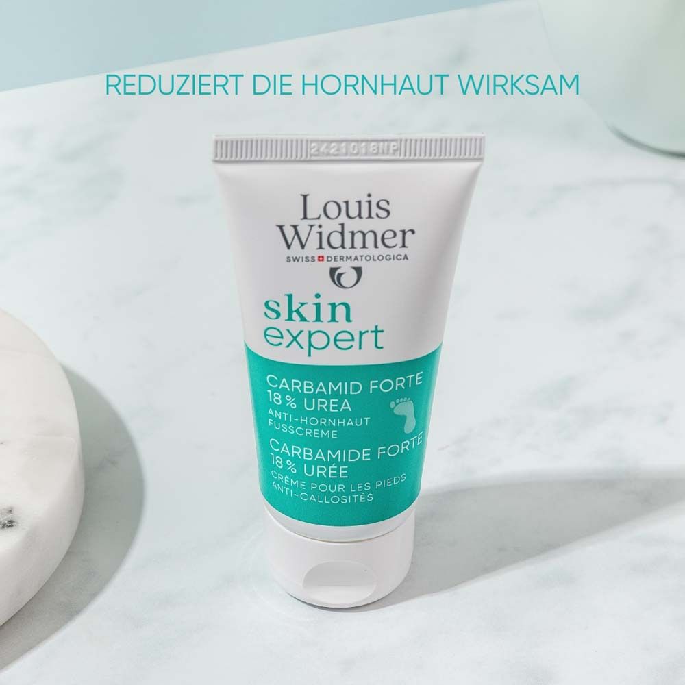 Weisse Tube mit Produktnamen und Text. Text: Carbamid Forte 18% Urea Anti-Hornhaut Fusscreme.