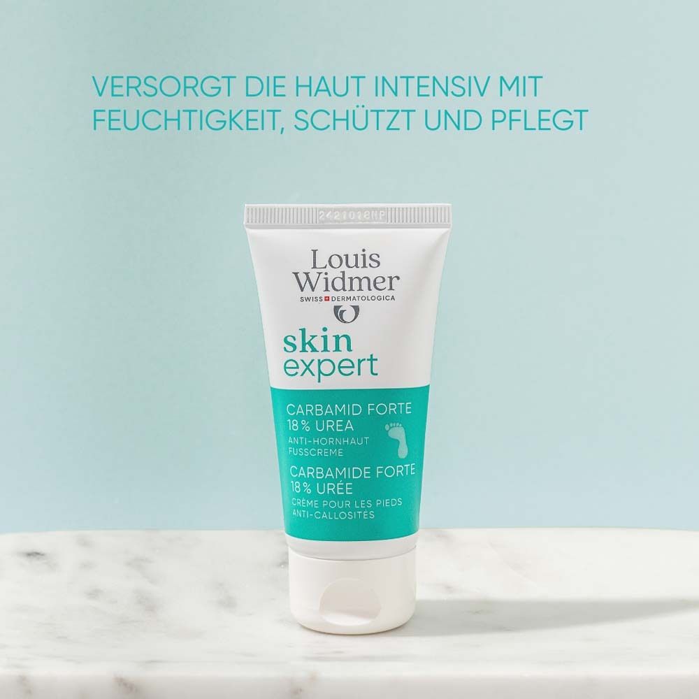 Weisse Tube mit Produktnamen und Text. Text: Carbamid Forte 18% Urea Anti-Hornhaut Fusscreme.