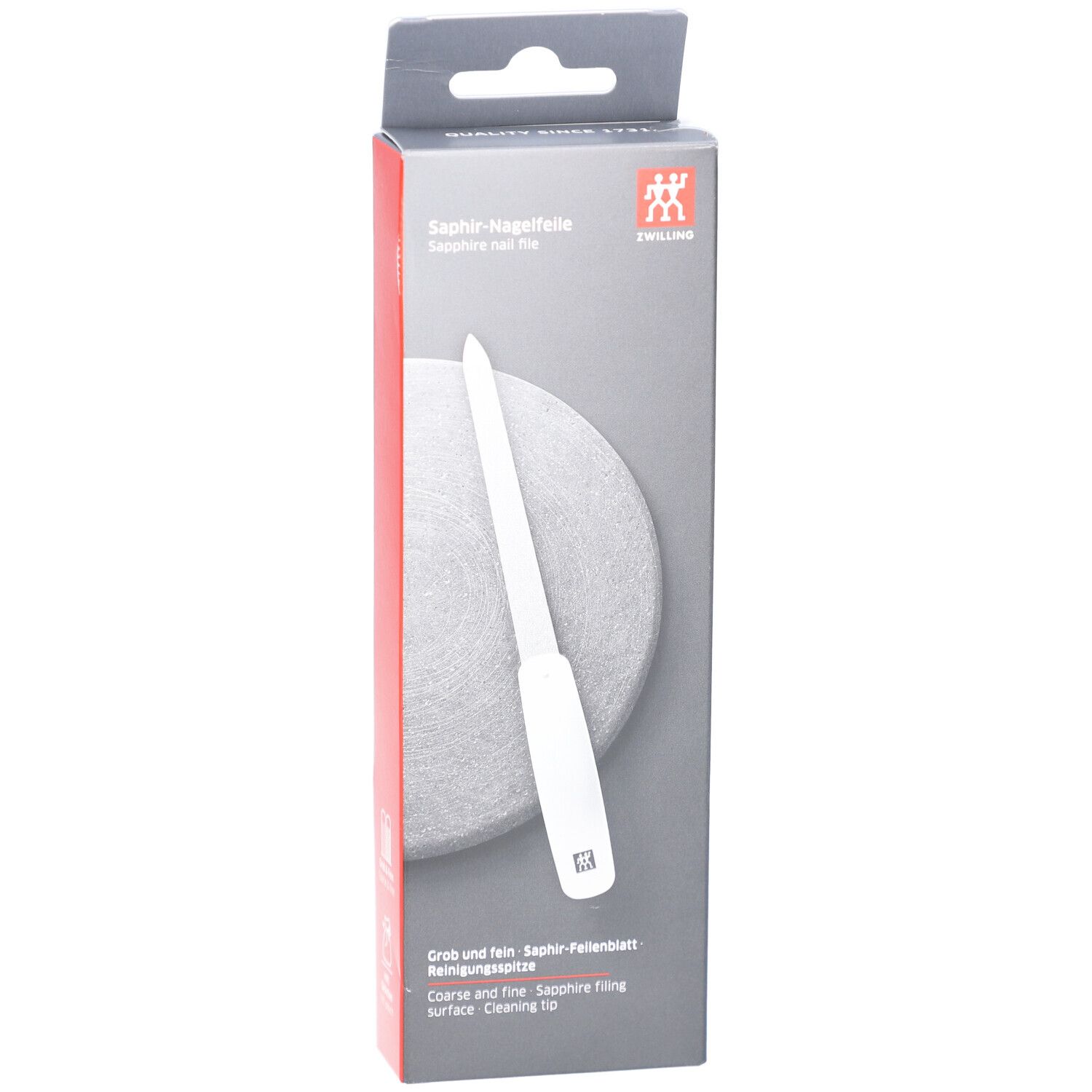 Emballage de la lime à ongles ZWILLING Saphir. Manche blanc, surface de limage grise. Inscription : Saphir-Nagelfeile, logo ZWILLING. Grossier et fin.