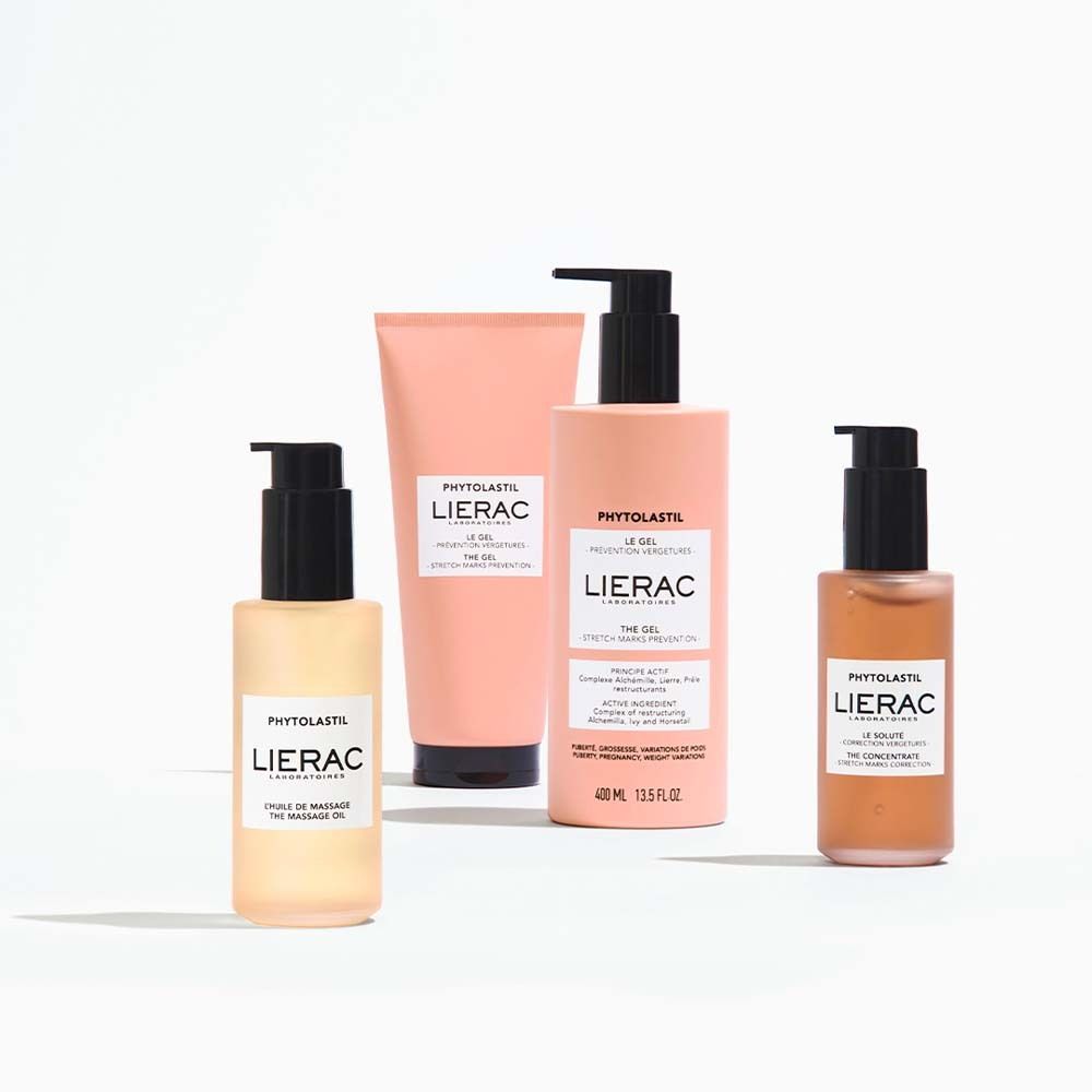 Quatre produits : flacon d'huile, tube, flacon et petit flacon. Tous avec le logo LIERAC et le nom du produit.