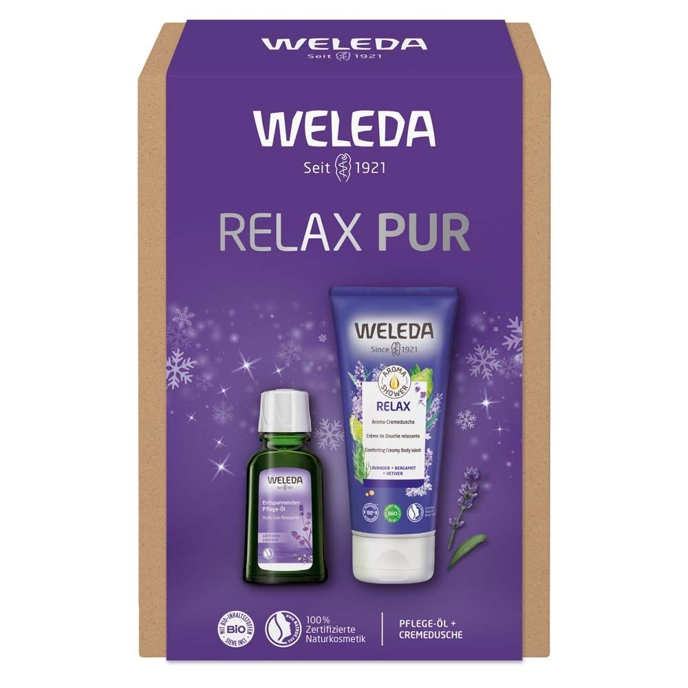 Geschenkset mit Pflegeöl und Cremedusche. Flasche und Tube mit lila Etiketten. Karton mit Logo und Schriftzug.