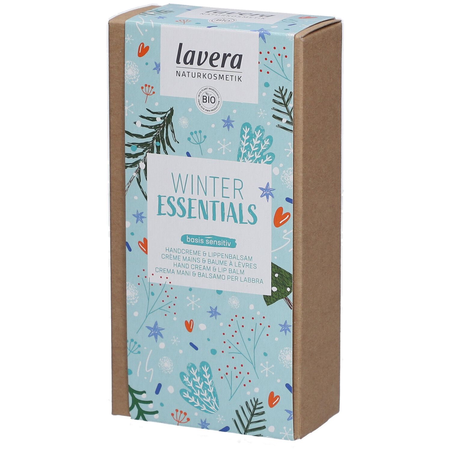 Boîte 'Winter Essentials' lavera. Fond bleu clair avec motifs hivernaux. Contient crème mains et baume à lèvres.