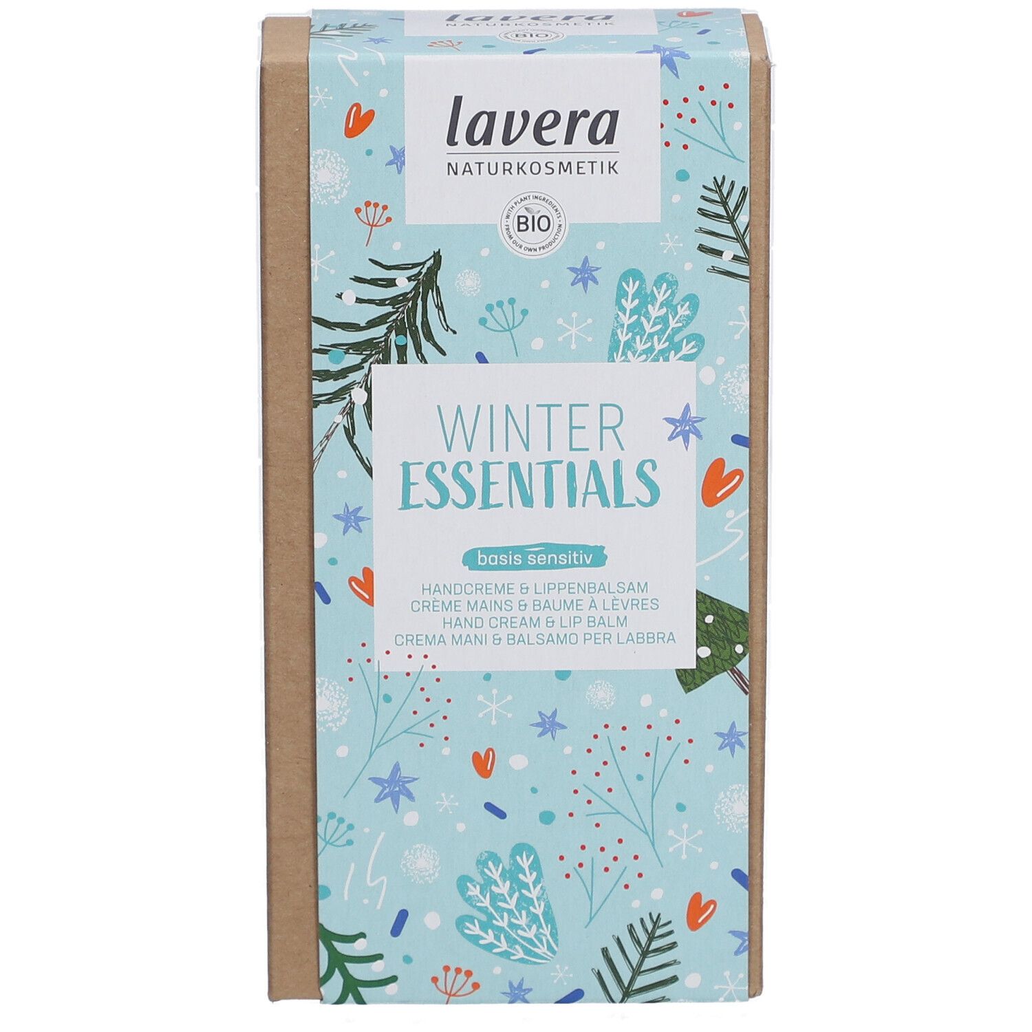 Boîte 'Winter Essentials' lavera. Fond bleu clair avec motifs hivernaux. Contient crème mains et baume à lèvres.