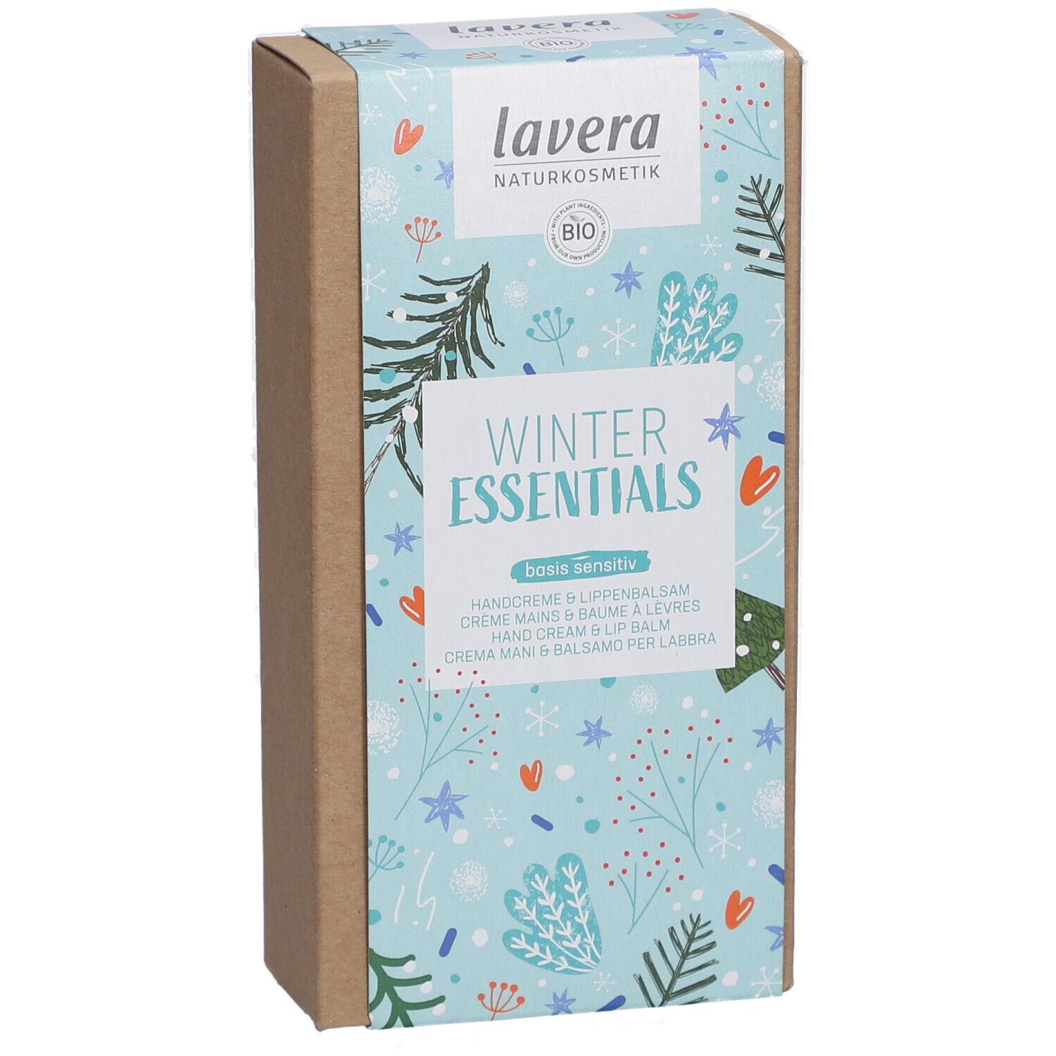 Boîte 'Winter Essentials' lavera. Fond bleu clair avec motifs hivernaux. Contient crème mains et baume à lèvres.