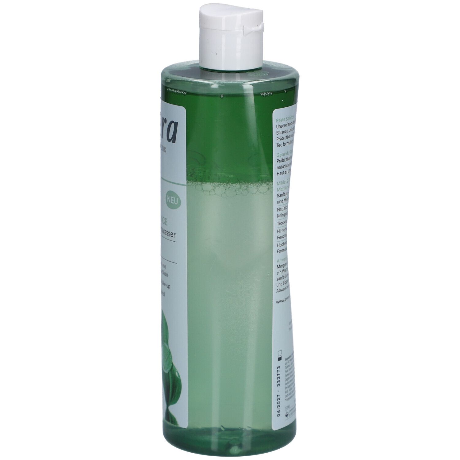 Flacon vert avec bouchon blanc. Texte sur le côté. Liquide visible à l'intérieur.