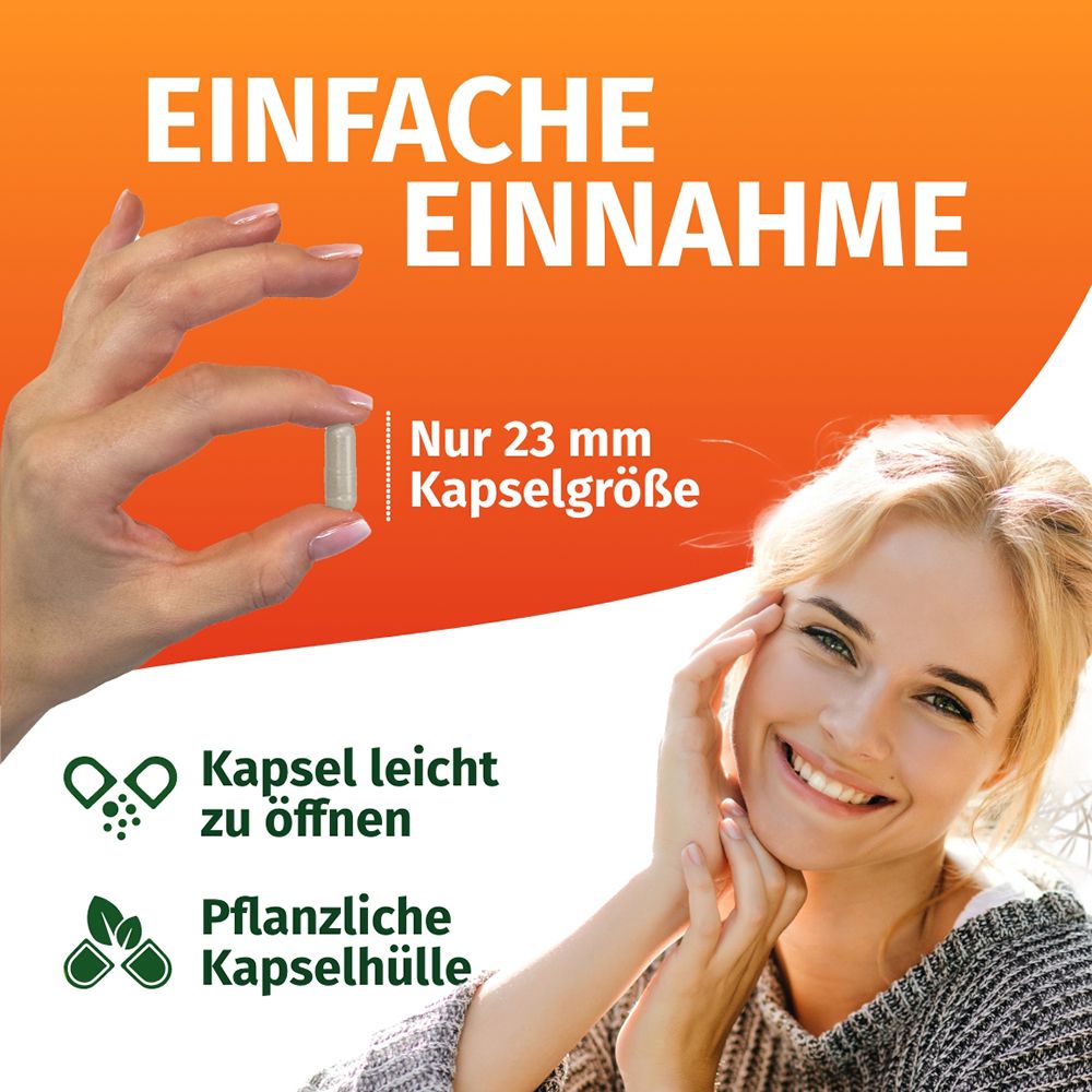 Femme tenant une gélule facile à ouvrir. Taille de la gélule 23 mm.