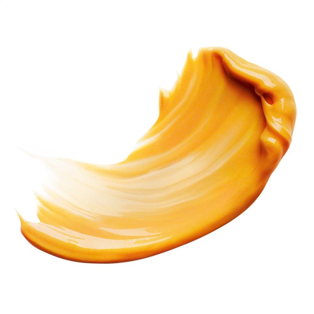 Texture de crème jaunâtre. Forme lisse et incurvée. Sur fond blanc.