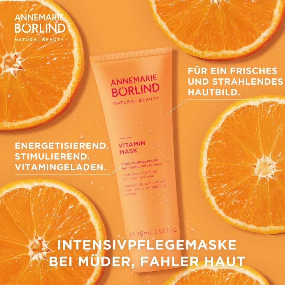 Tube orange avec Vitamin Maske. Tranches d'orange en arrière-plan. Texte: Annemarie Börlind.