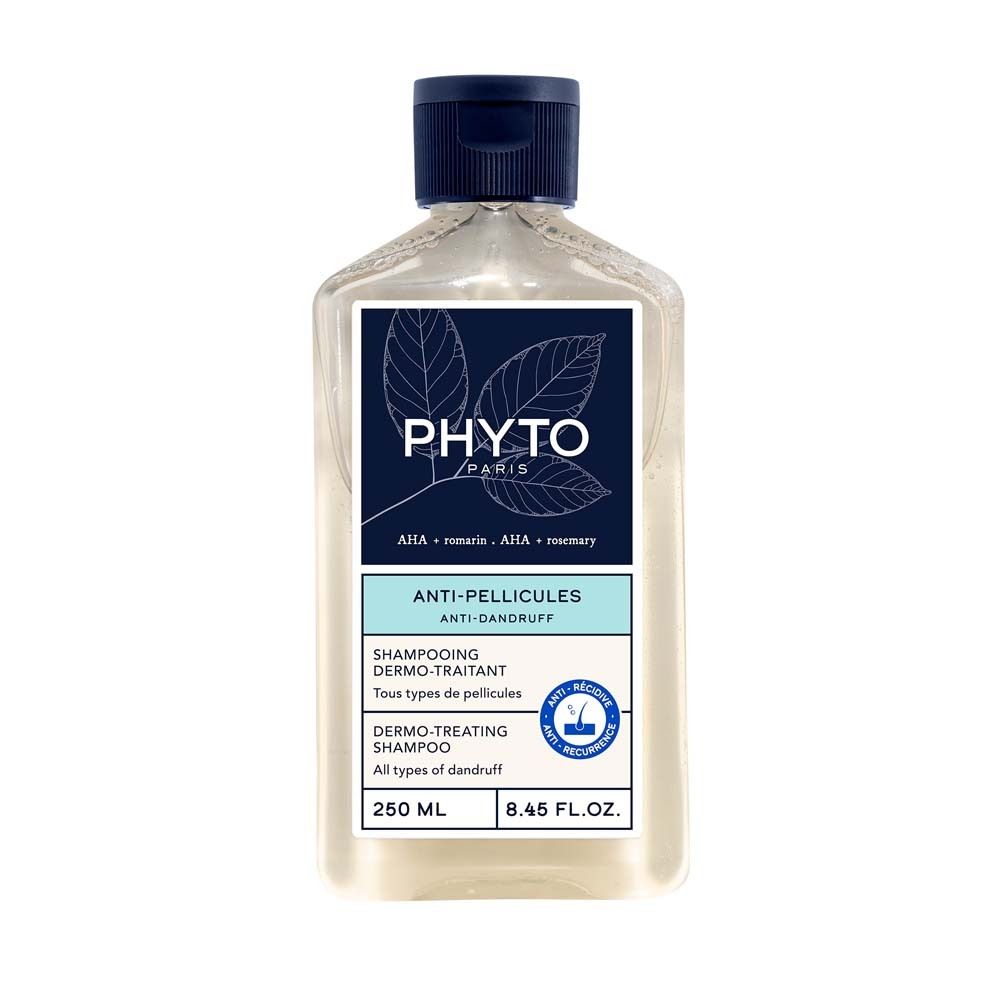 Klarflüssiges Shampoo in einer quadratischen Flasche mit blauem Deckel. Etikett mit Logo und Produktinformationen.