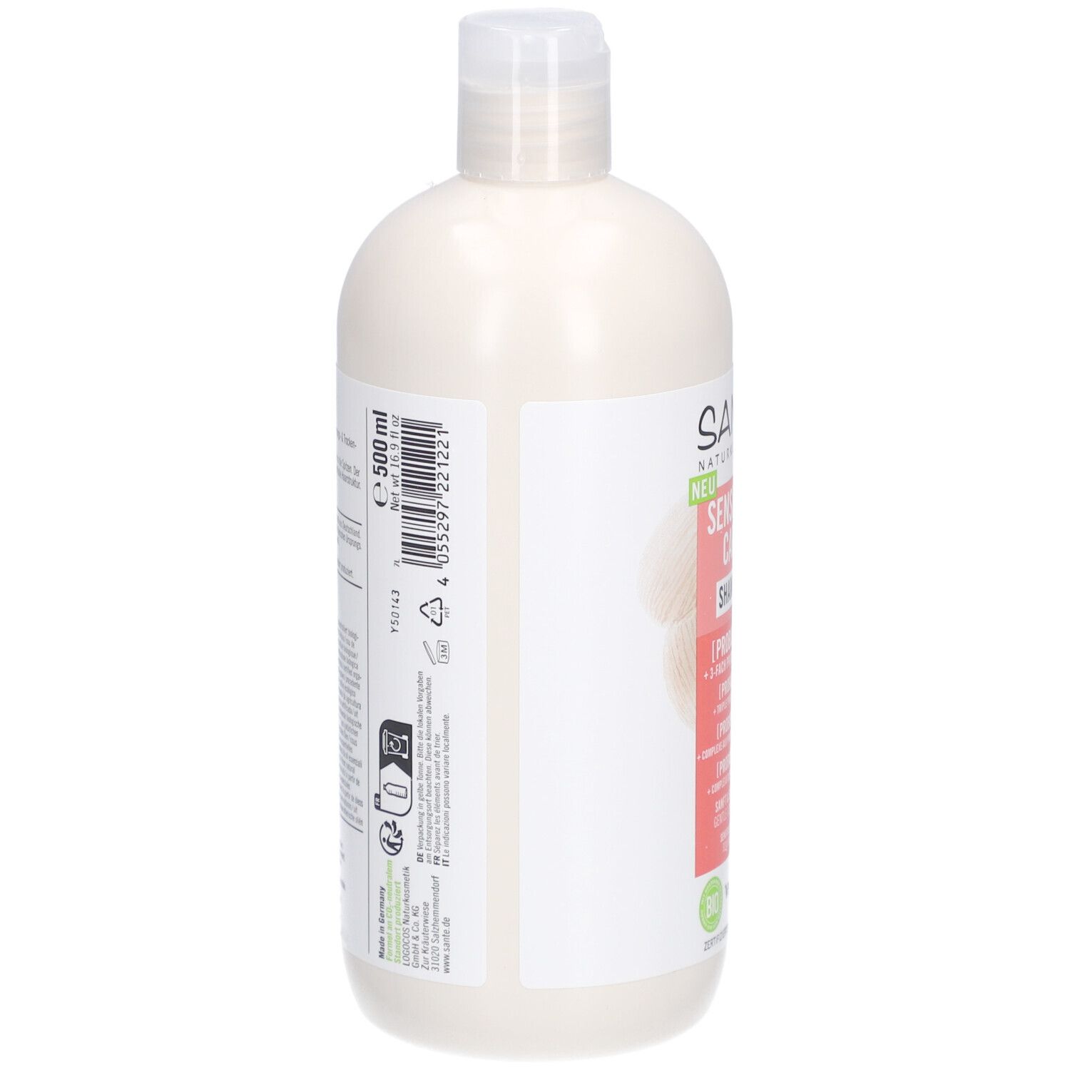 Dos d'un flacon de shampooing beige avec bouchon blanc. Texte et symboles sur étiquette blanche. Volume: 500 ml.