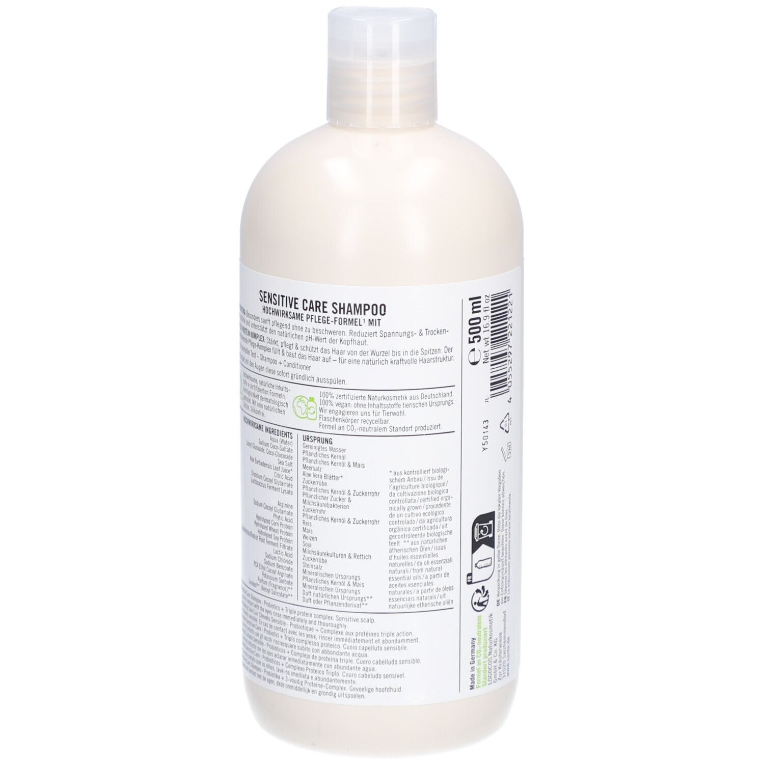 Dos d'un flacon de shampooing beige avec bouchon blanc. Texte sur étiquette blanche. Ingrédients et informations.