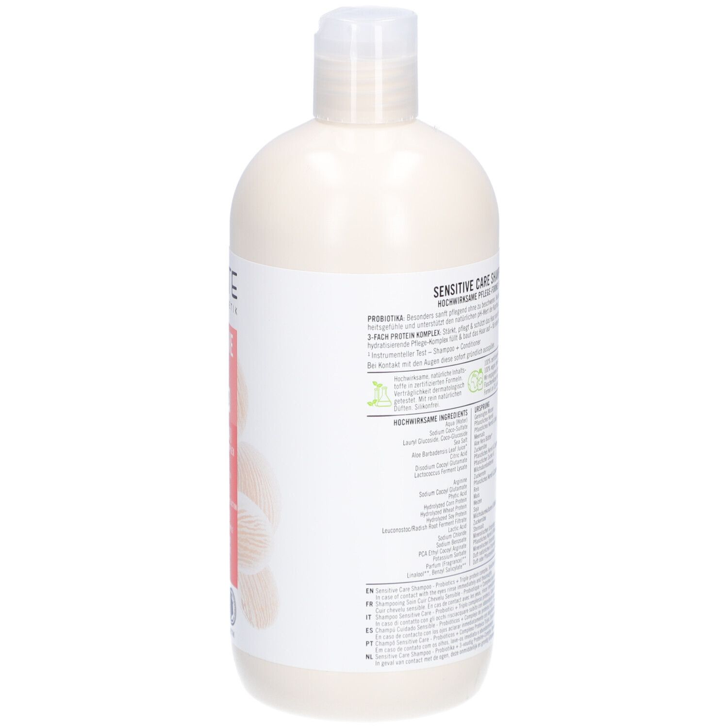 Dos d'un flacon de shampooing beige avec bouchon blanc. Texte sur étiquette blanche. Ingrédients et informations.