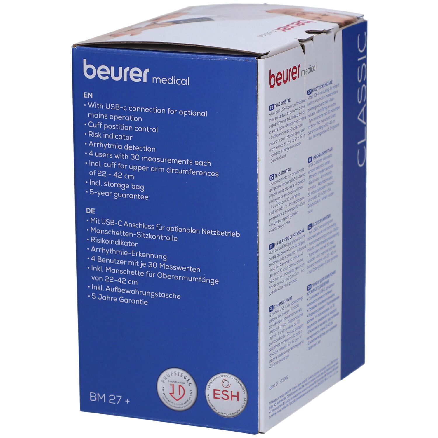 Emballage avec texte multilingue. Contient des informations sur l'appareil. Logos: ESH, ID. Texte: Beurer, BM 27+.