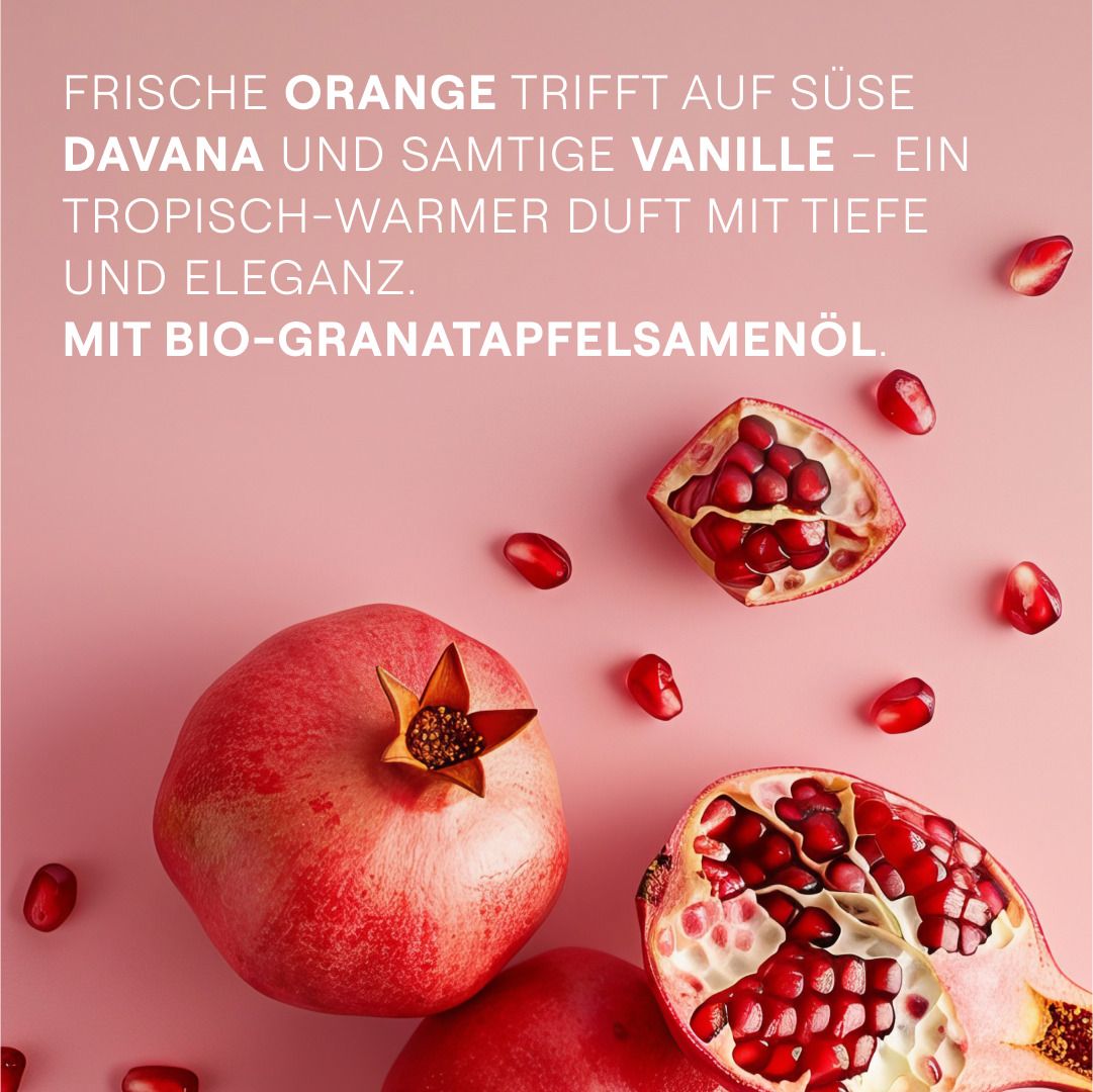 Grenades sur fond rose. Texte: Orange fraîche rencontre davana et vanille. Avec huile de graines de grenade bio.