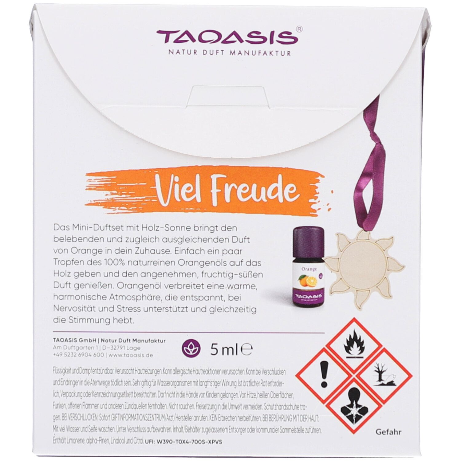 Rückseite der Verpackung. Flasche, Holzanhänger, Text. Aufdrucke: "Viel Freude", "5ml", Gefahrensymbole.