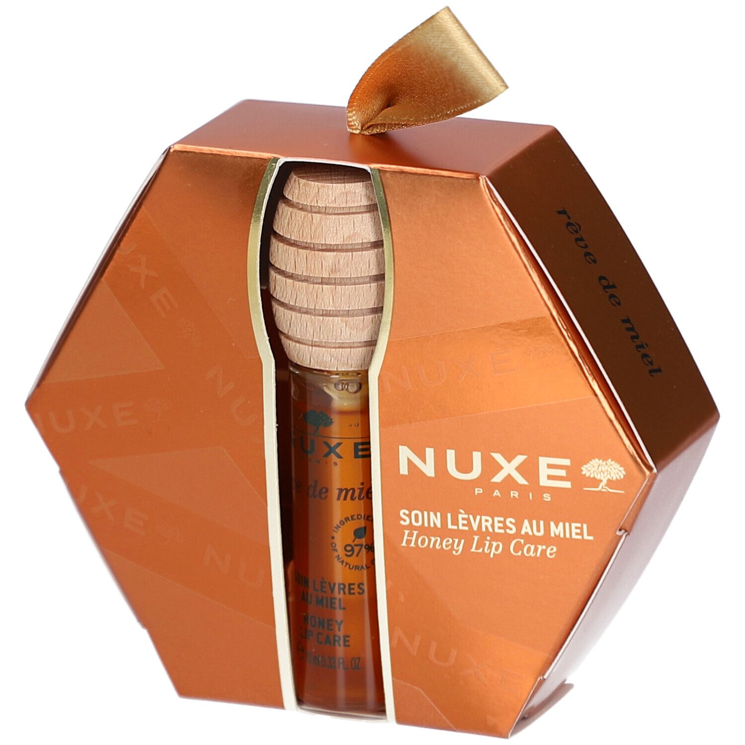 Geschenkset mit Honig-Lippenpflege. Sechseckige, goldfarbene Verpackung mit Produkt und Honiglöffel. NUXE-Logo sichtbar.