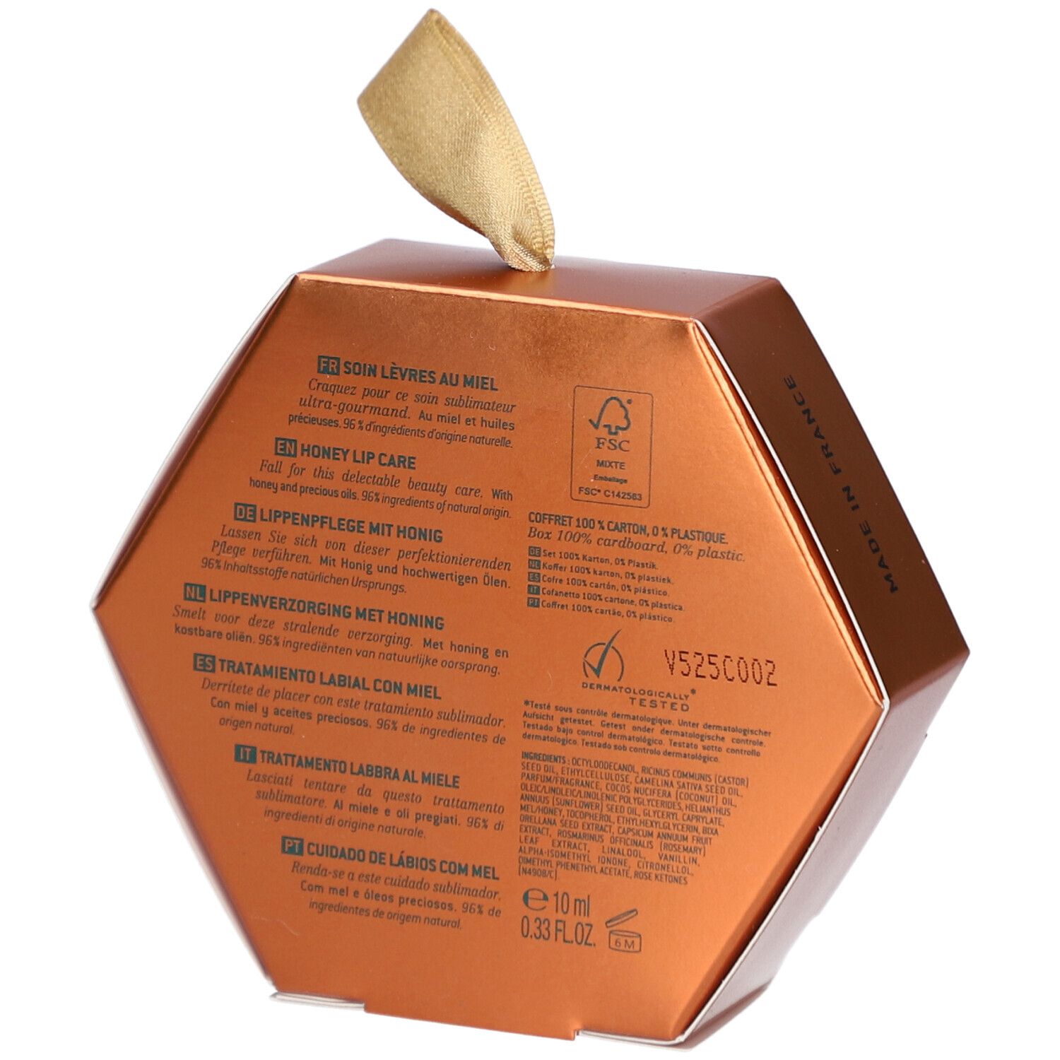 Rückseite der goldfarbenen, sechseckigen Verpackung. Text in mehreren Sprachen. FSC-Logo und andere Zertifizierungen.