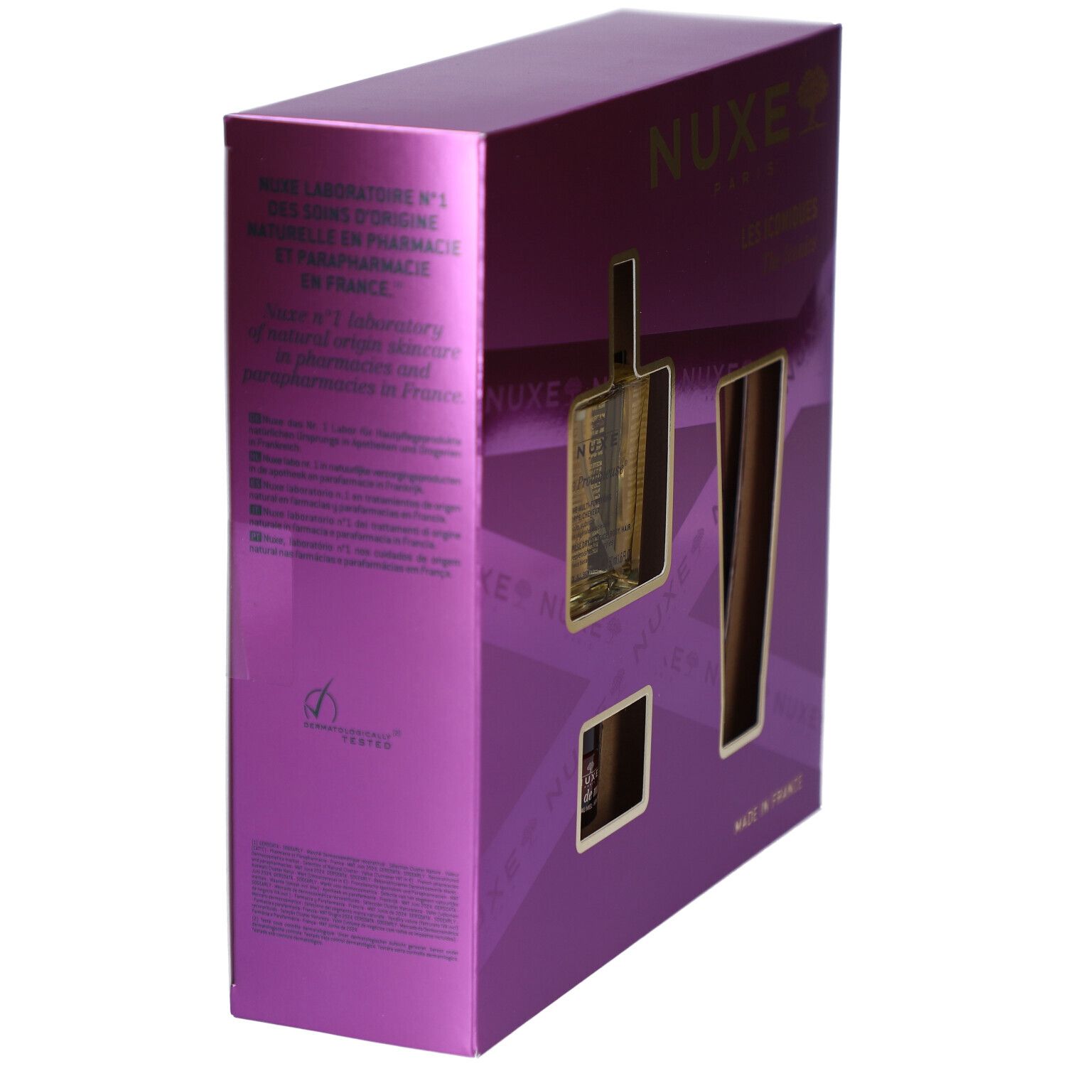Seitenansicht der lila Geschenkbox. Der Markenname NUXE ist sichtbar. Text in mehreren Sprachen. "Made in France" ist ebenfalls sichtbar.