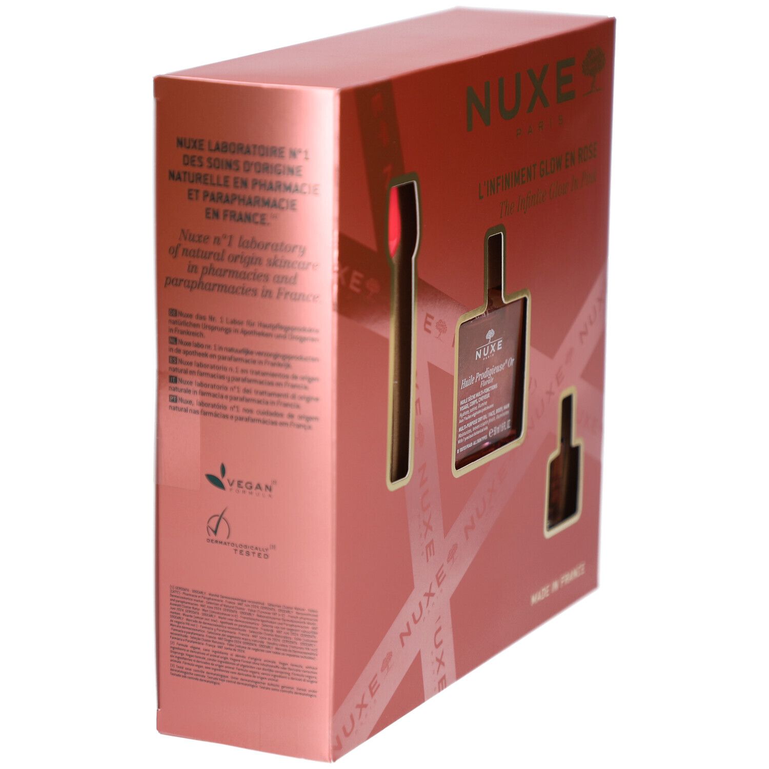 Rosa Geschenkbox mit Text. Enthält Informationen über das Produkt und das Label 'Vegan'. Marke NUXE.