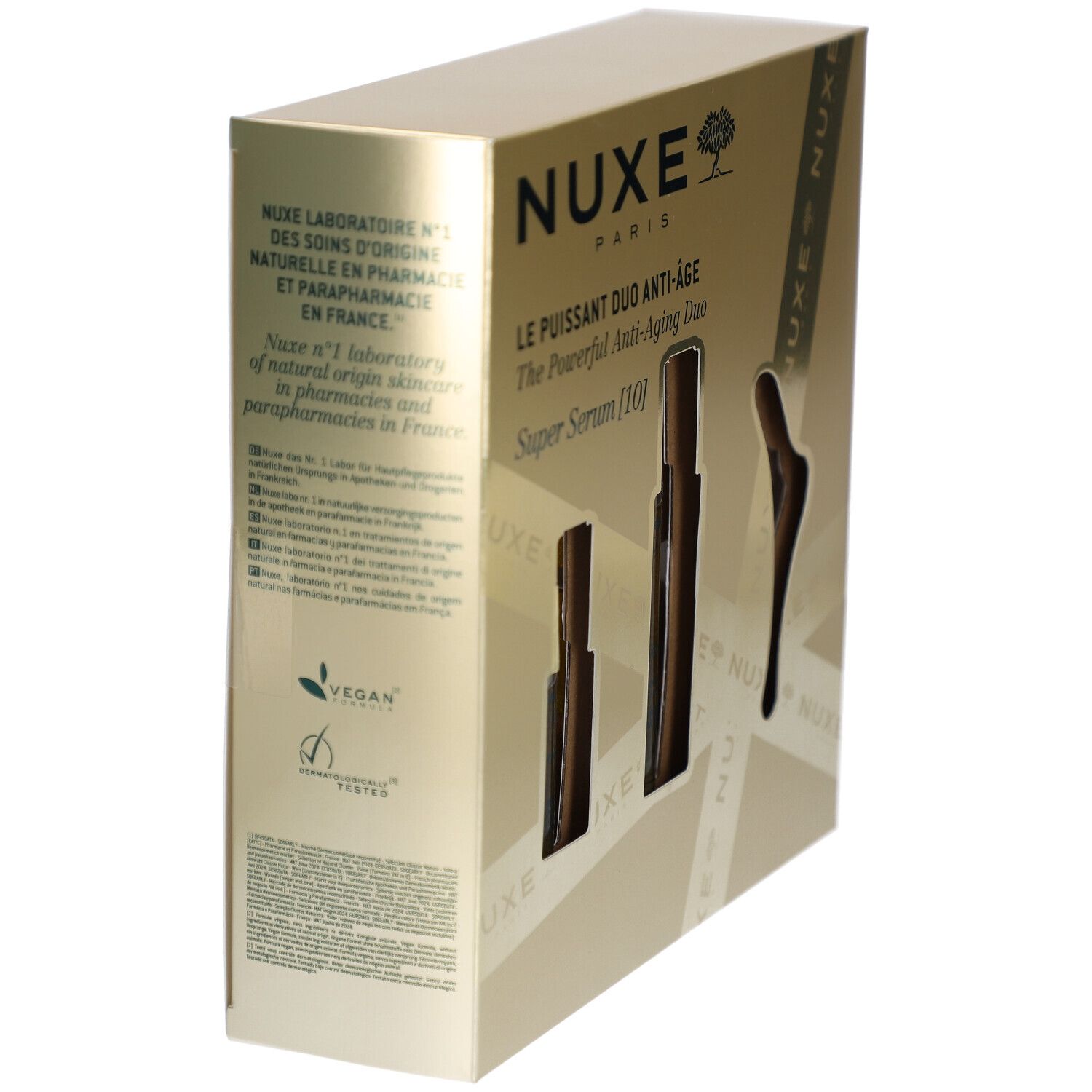 Goldfarbene Geschenkbox mit Produktinformationen und Logo. Vegan-Zertifizierung und weitere Texte.