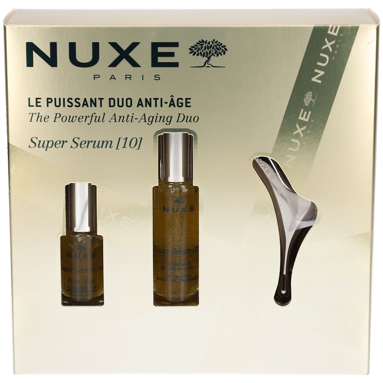 Geschenkbox mit zwei Serumflaschen und einem Massage-Tool. Produktname und Logo sichtbar.