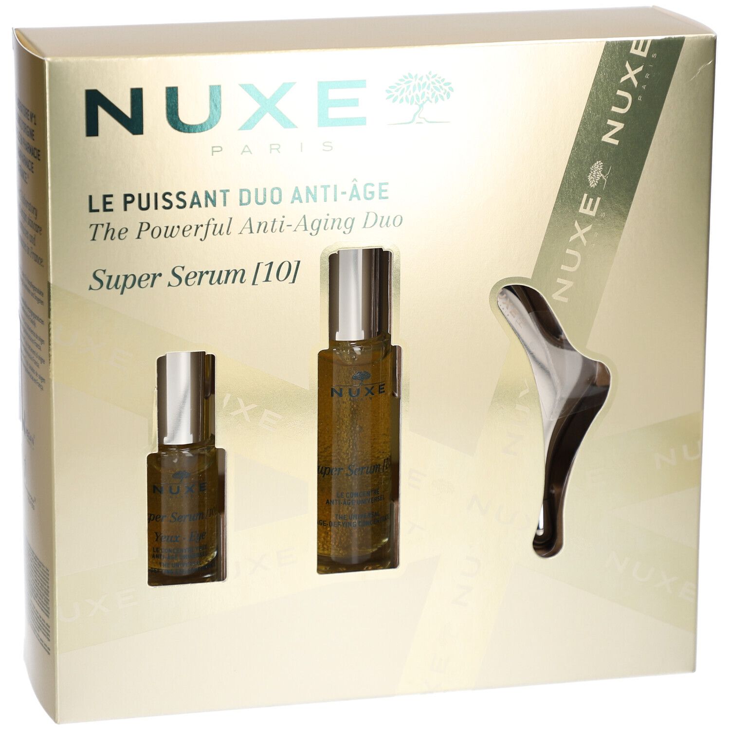 Geschenkbox mit zwei Serumflaschen und einem Massage-Tool. Produktname und Logo sichtbar.