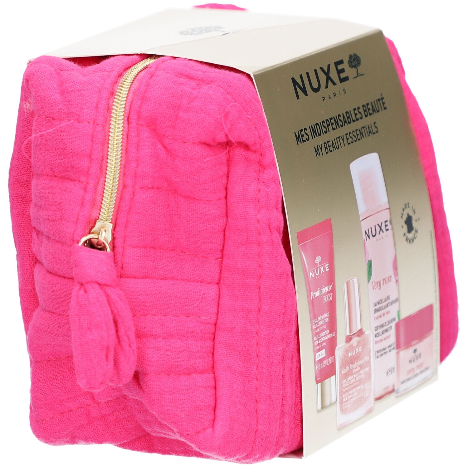 Pinkfarbene Kosmetiktasche mit goldenem Reißverschluss. Goldfarbene Verpackung mit NUXE-Produkten. Produkte sichtbar.