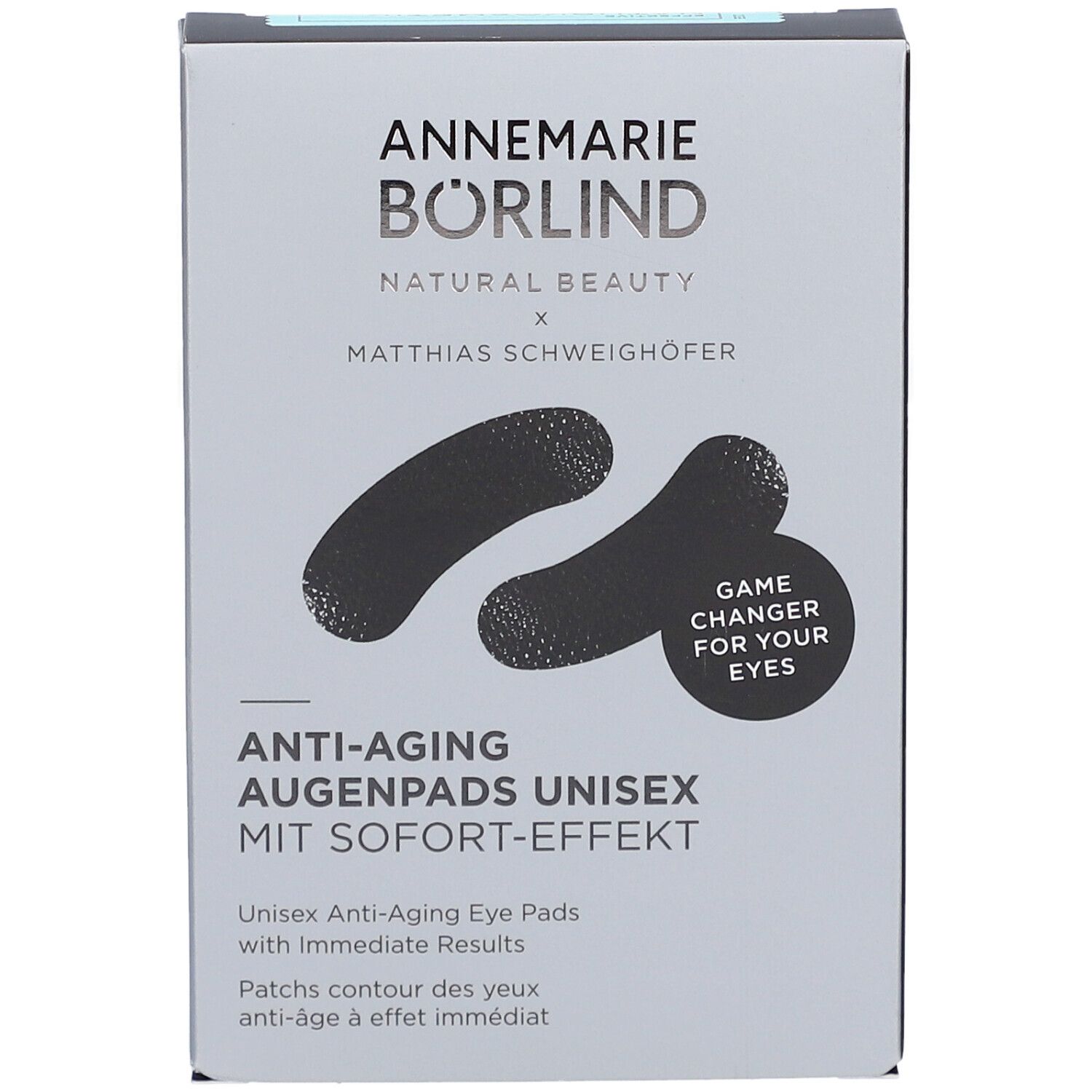 Boîte grise avec patchs noirs pour les yeux. Inscription: ANNEMARIE BÖRLIND, Anti-Aging Augenpads Unisex. Avec effet immédiat. Game Changer for your eyes.