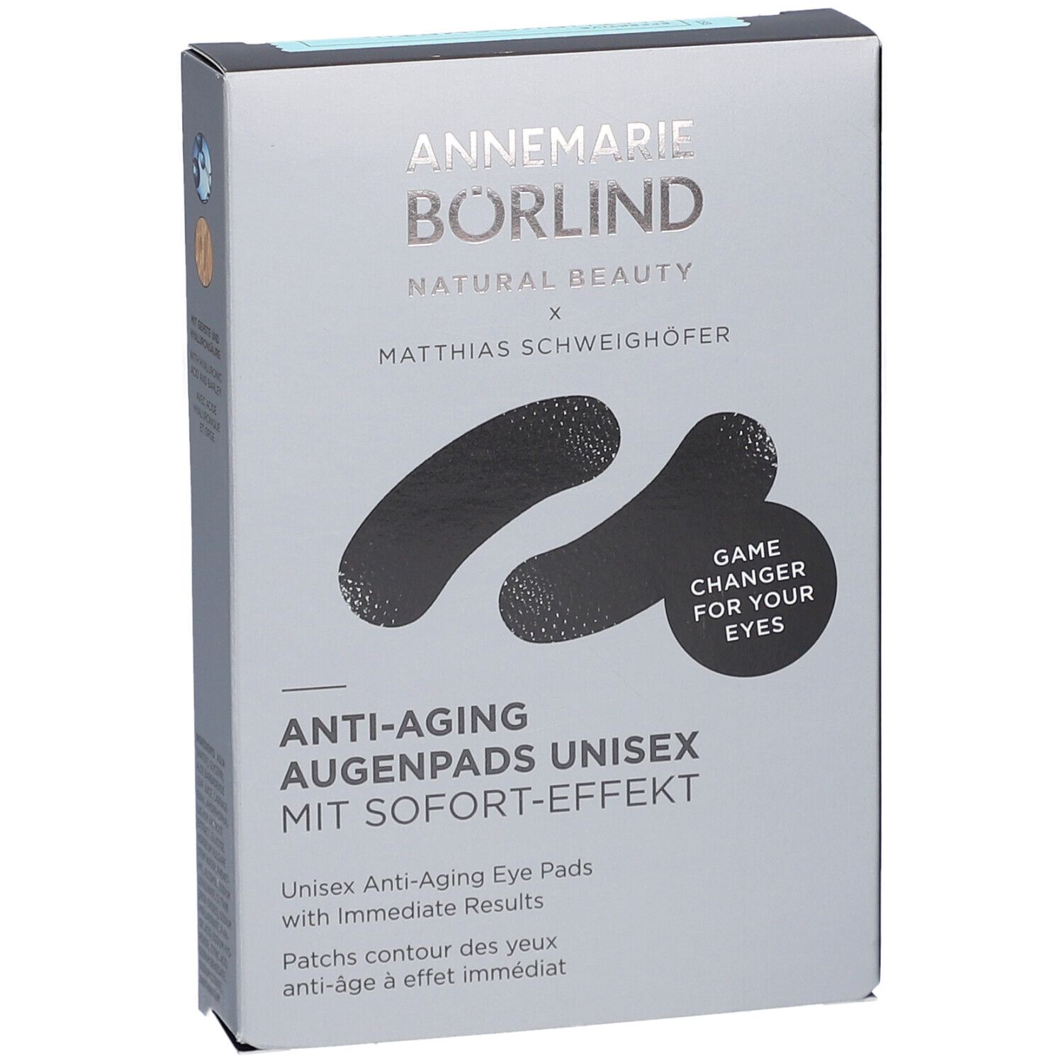 Boîte grise avec patchs noirs pour les yeux. Inscription: ANNEMARIE BÖRLIND, Anti-Aging Augenpads Unisex. Avec effet immédiat. Game Changer for your eyes.