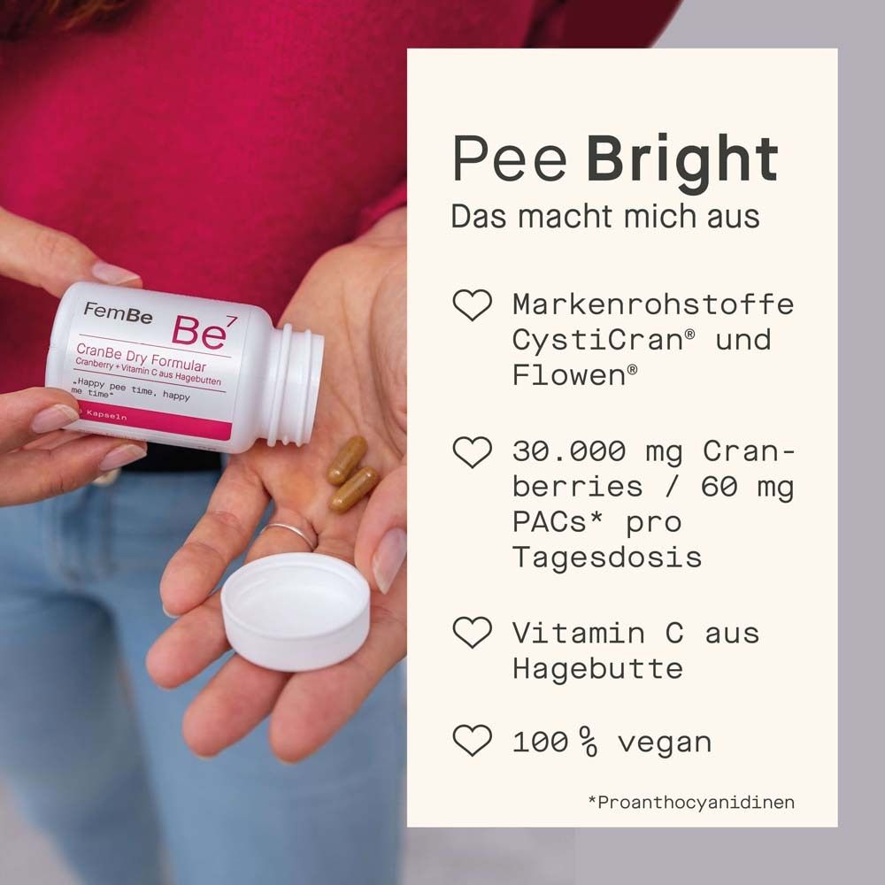 Main tenant flacon FemBe Be7 CranBe Dry Formular. Texte : Pee Bright. 100% végétalien.