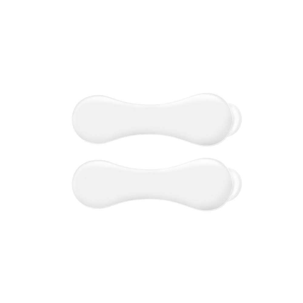 Deux pads buccaux blancs ovales. Ils ont une forme étroite et allongée avec des extrémités arrondies.