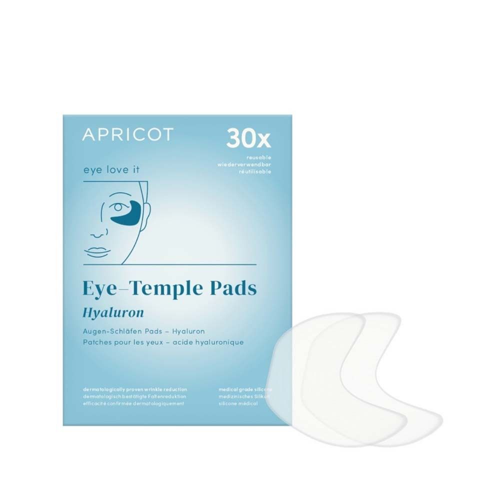 Verpackung mit Augen-Schläfen Pads. Marke APRICOT. 30 Stück. Pads und Verpackung liegen nebeneinander. Aufschrift: Eye-Temple Pads Hyaluron.