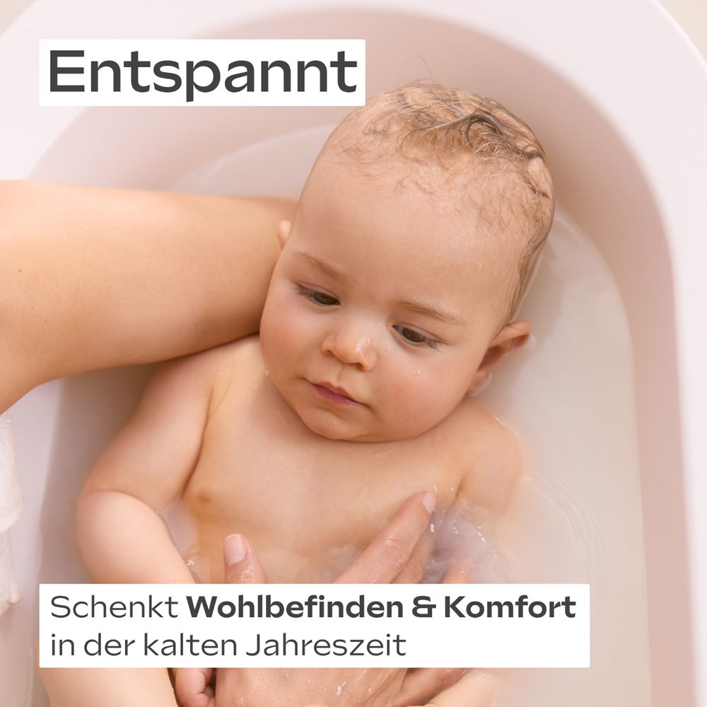 Bébé dans le bain. Texte : Détendu. Procure bien-être et confort en hiver.