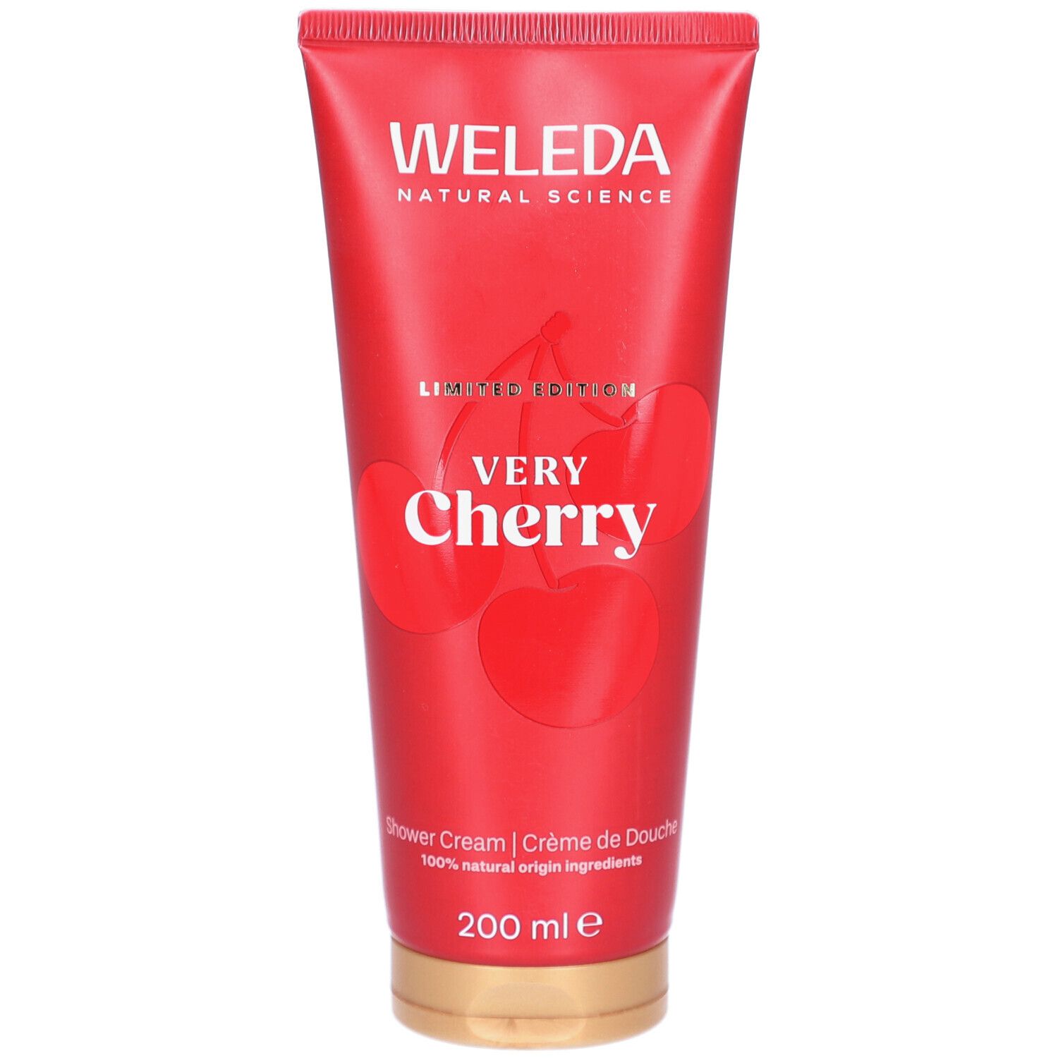 Tube rouge WELEDA Very Cherry, édition limitée. Illustration de cerises. Inscription "Shower Cream". Bouchon doré.