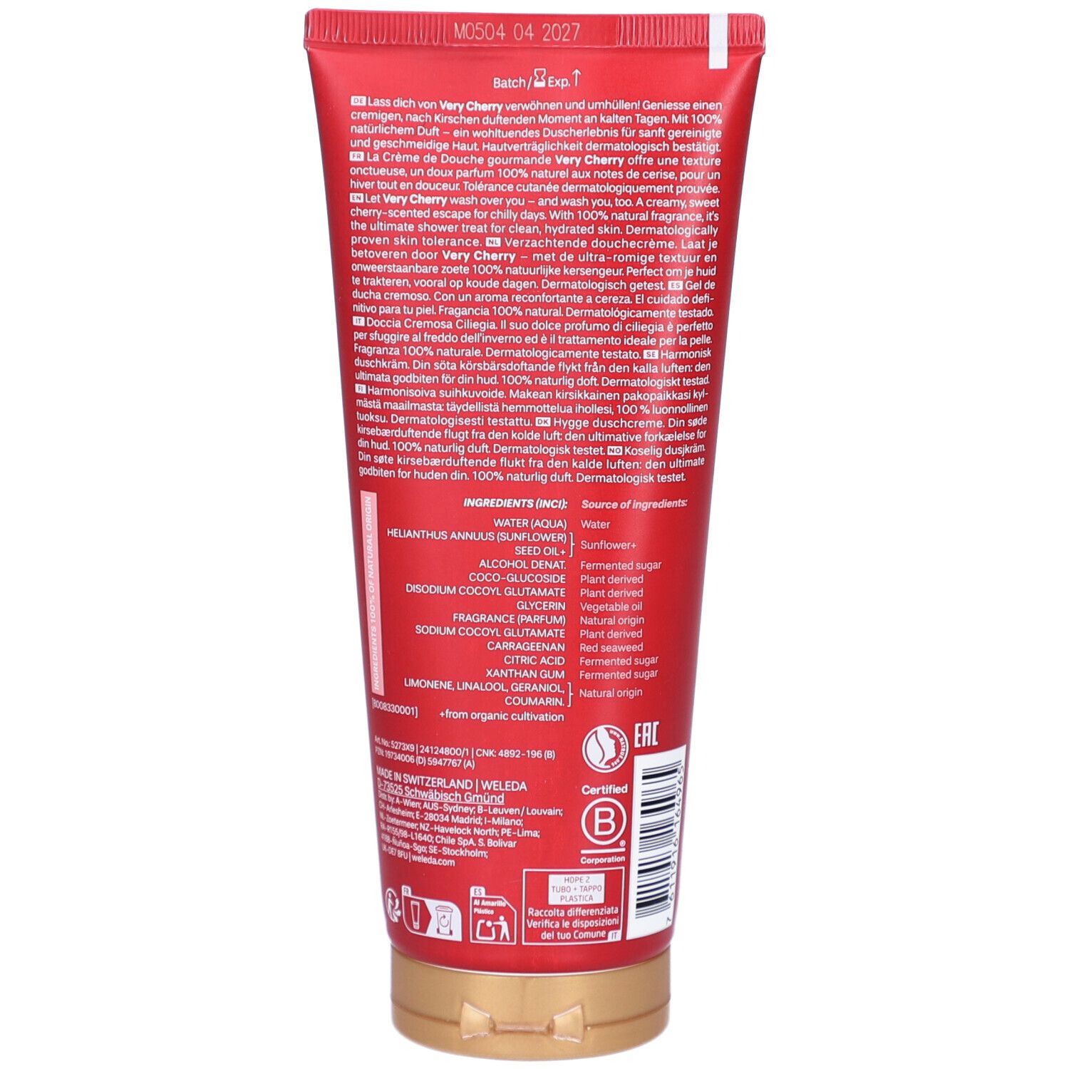 Dos du tube rouge. Texte multilingue. Ingrédients et certifications. Bouchon doré.