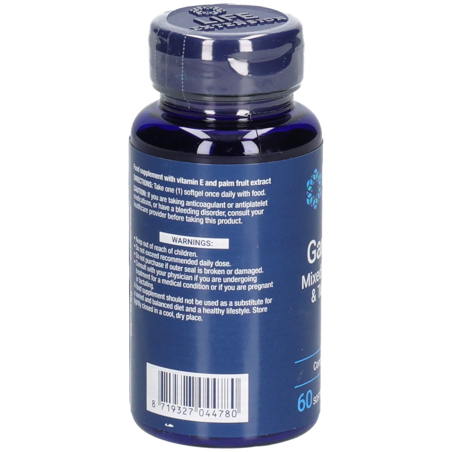 Rückseite der blauen Flasche mit Kapseln. Aufschrift: Gamma E, Mixed Tocopherols & Tocotrienols. Warnhinweise und Barcode.