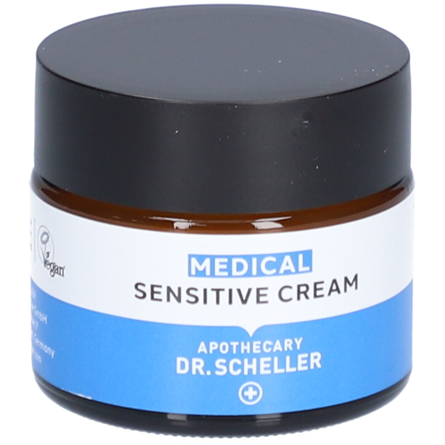 Crème en pot de verre brun avec couvercle noir. Inscription: MEDICAL SENSITIVE CREAM, Apotheke DR. SCHELLER. Label Vegan.