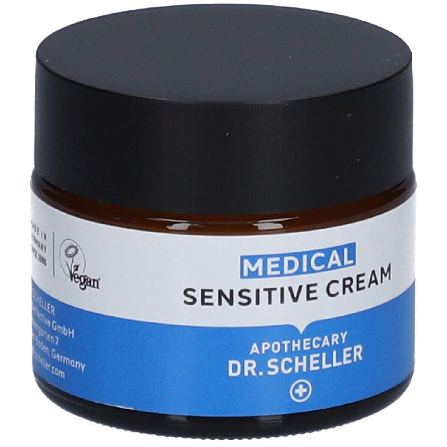 Crème en pot de verre brun avec couvercle noir. Inscription: MEDICAL SENSITIVE CREAM, Apotheke DR. SCHELLER. Vegan, Made in Germany.