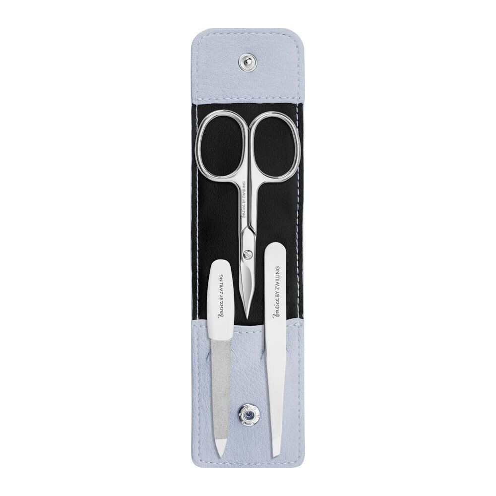 Set de manucure avec étui. Ciseaux, lime et pince à épiler. Marque Basics by Zwilling. Étui bleu clair.