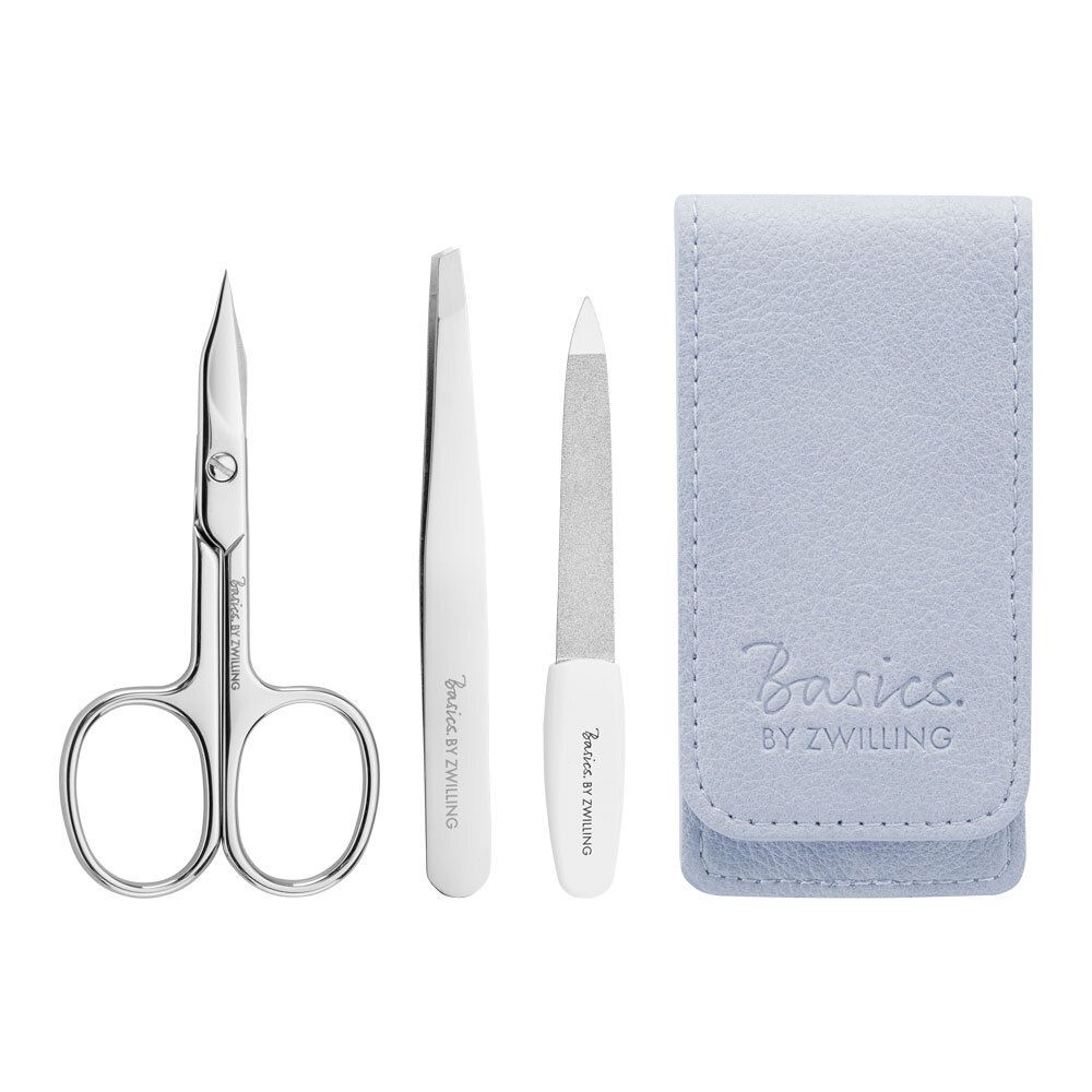 Set de manucure avec étui. Ciseaux, pince à épiler et lime. Marque Basics by Zwilling. Étui bleu clair.