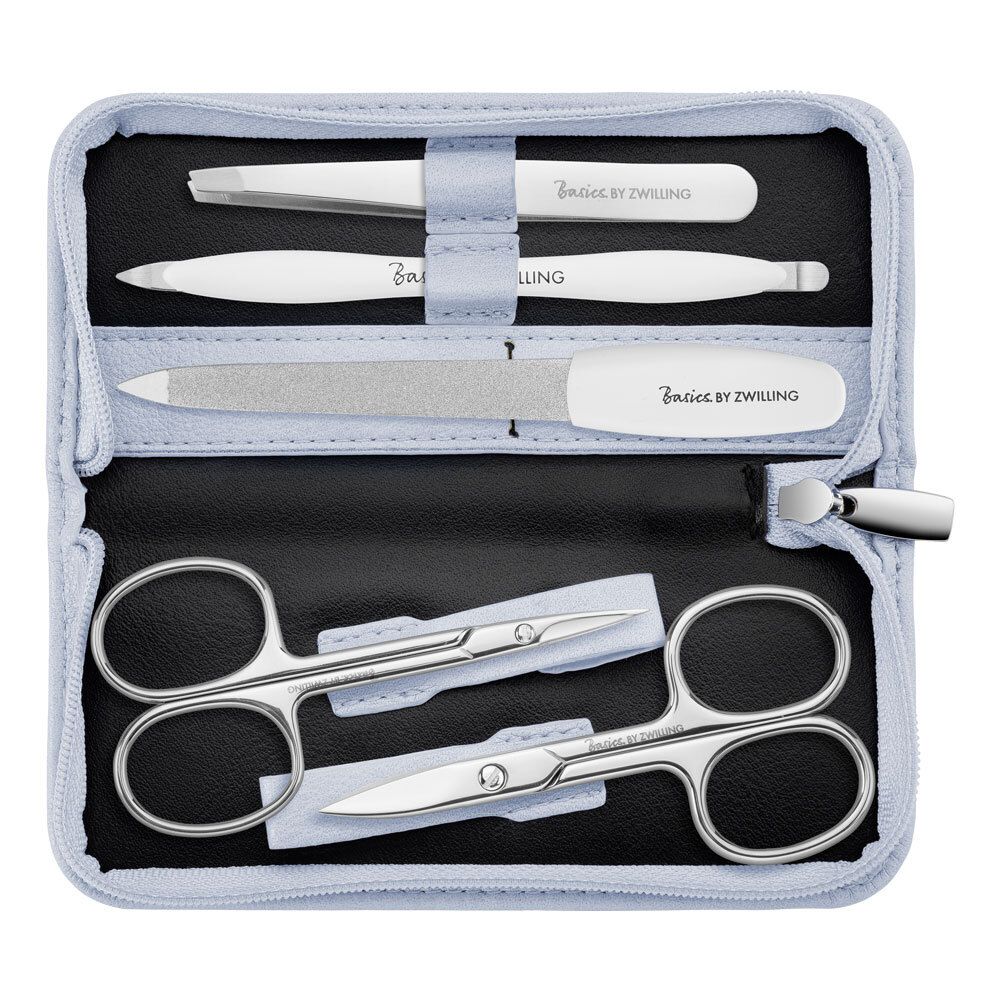 Étui ouvert avec set de manucure. Contient pince à épiler, repousse-cuticules, lime et ciseaux. Marque : Basics by Zwilling.
